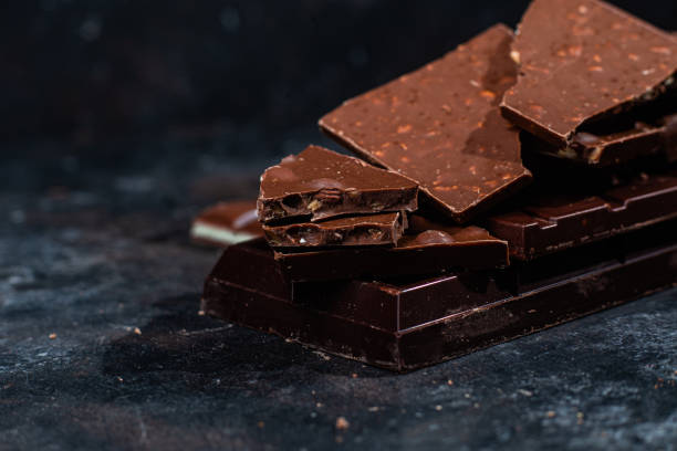 istock Chocolate bars on a dark background close-up 1470732765