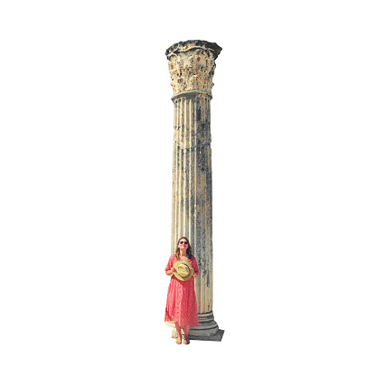 Tourist on the hill Byrsa at the Roman marble column, isolated on a white background. Ruins of Carthage, Tunisia
