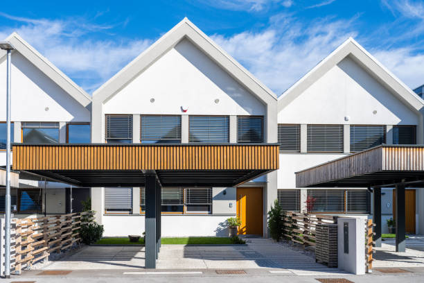 New modern apartment two storey buildings facade at city street outdoors at sunny day