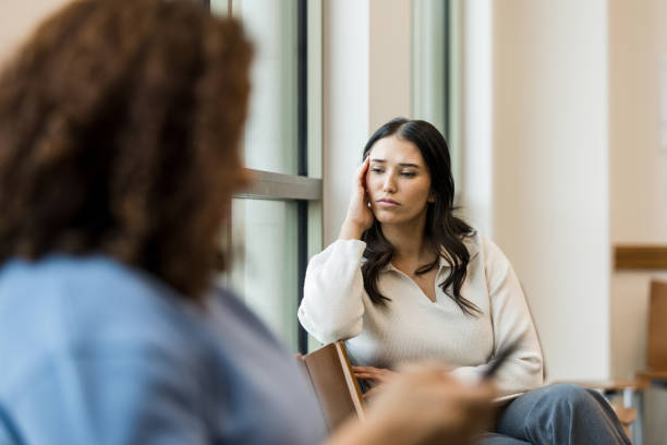 istock Distraught young woman waits to see therapist 1470735545