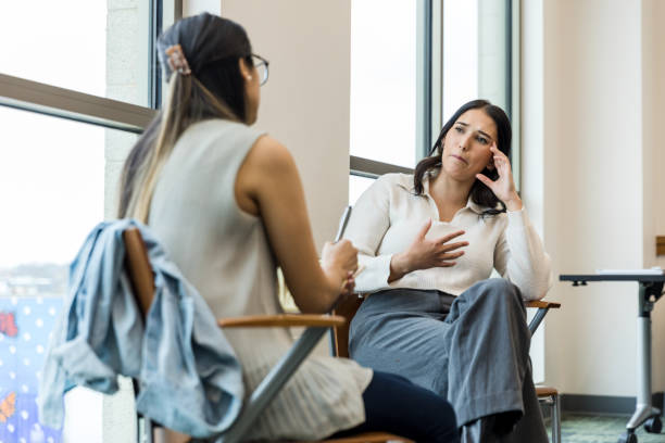 istock Distraught young woman shares issues with unrecognizable counselor 1470735578