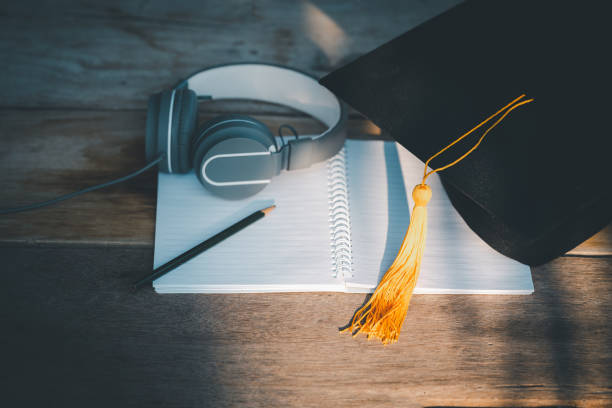 istock Graduation Cap university pace on wood table graduation concept 1470735737