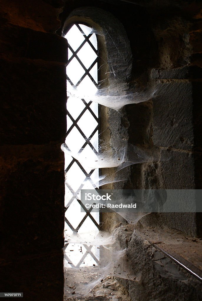 Lancet window with spider webs Lancet window with spider webs in Ely Cathedral Ely Cathedral Stock Photo