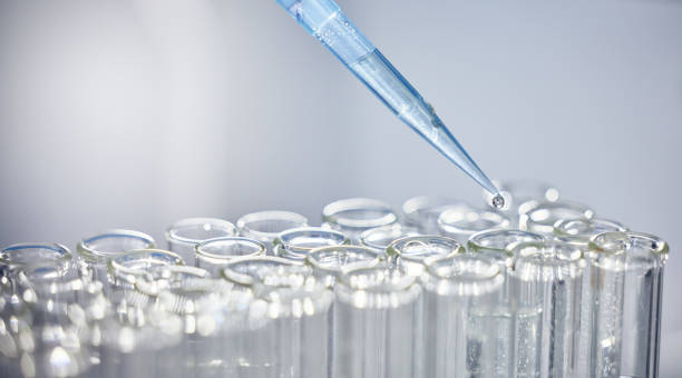 istock Science, test tubes and syringe for research, experiment or project in chemistry laboratory. Glass vials, innovation and chemical liquid for scientific innovation or analysis in a pharmaceutical lab. 1470739501