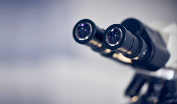 istock Microscope, science and mockup with tools in lab for scientific research, vision and experiment. Innovation with medical analysis, technology and molecule, biotechnology, and particles in laboratory. 1470739548