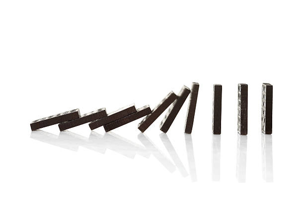istock Chain reaction of domino blocks falling down 147074044
