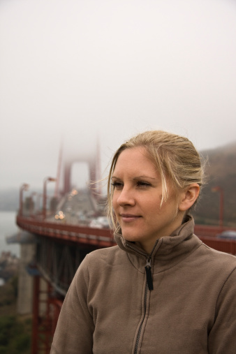 Pretty women in front of The Golden Gate Bridge