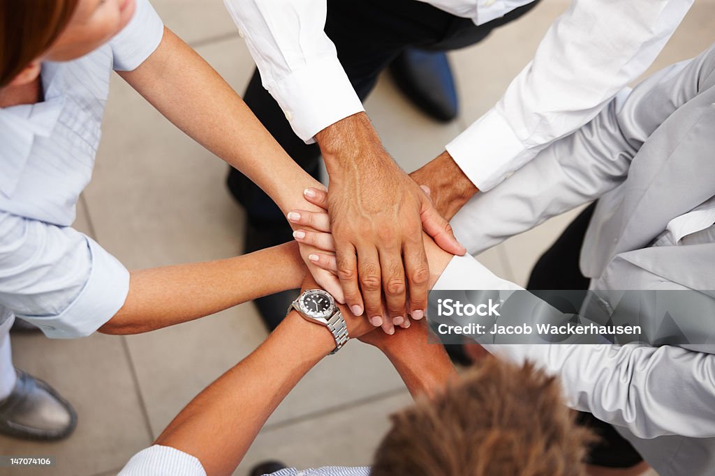 High angle view of business colleagues showing unity Corporate Business Stock Photo