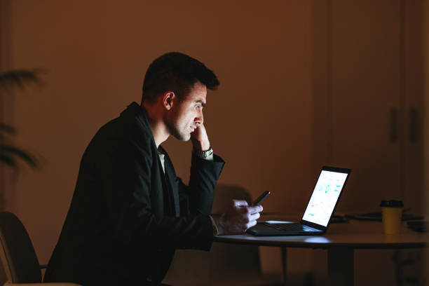 istock Worried Businessman Working At Home Office At Night 1470741810