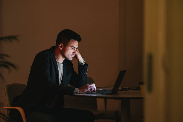 istock Worried Businessman Working At Home At Night 1470741823