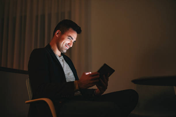 istock Happy Businessman Using A Digital Tablet At Home Office At Night 1470741888