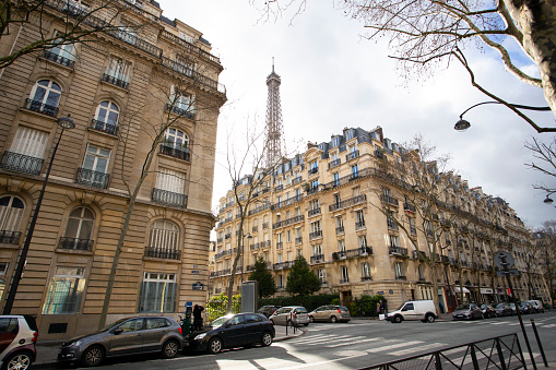 PARIS, FRANCE - MARCH 28, 2018: beautiful view from the streets of Paris and the eiffel tower in the background