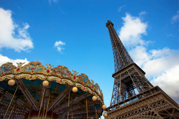 istock eiffel tower and carousel against the blue sky 1470742061