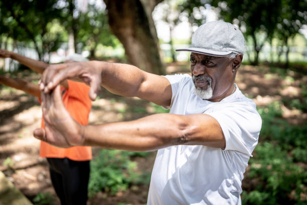 istock Senior man stretching in the park 1470743771