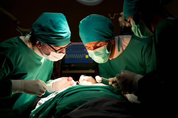 istock Team doctors in operating room dressed green uniforms saving lives critically patient undergoing heart surgery for heart patients There standardized surgical tools life-saving tool such heart pumps 1470744602