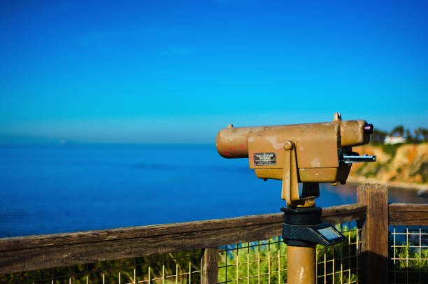 istock Sightseeing telescope binoculars overlooking the ocean on a bright day 1470744777