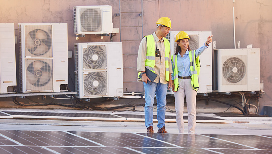 Solar panels, roof or engineering team planning photovoltaic construction for renewable energy development. Solar energy, innovation or engineers working on an industrial building or grid project