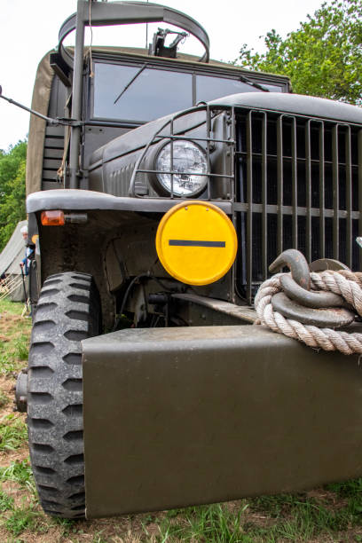 WWII military vehicle close up Wheel, bumper and grille of a WW2 American military vehicle close up jeep 4x4 off road vehicle world war ii stock pictures, royalty-free photos & images