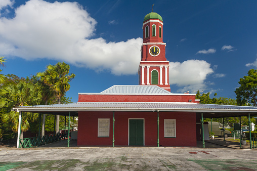 Famous red clock tower on the main guardhouse at the Garrison Savannah  UNESCO garrison historic area Bridgetown, Barbados