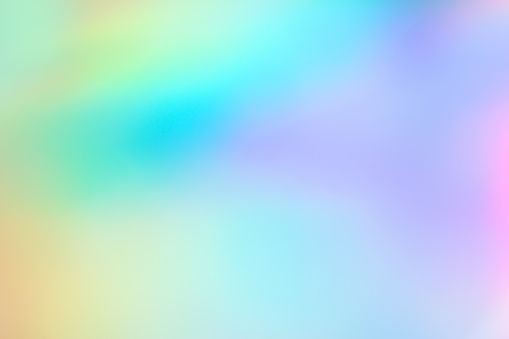 Abstract holographic neon foil background, holographic paper blurred background, iridescent colors, copy space