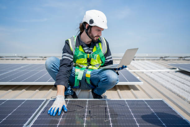 istock The supervisor is checking on solar panels with laptop on the rooftop 1470750654