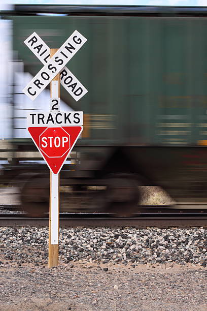 istock Rail Road Crossing, Green freight car in motion 147075109