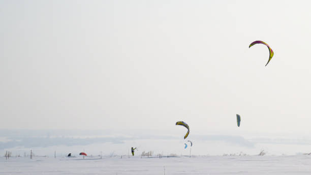 istock the man is snowkiting in the field 1470753179