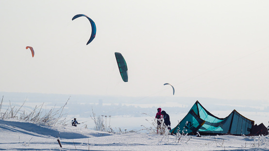 A lot of people do snowkiting. Parachuting in snowy terrain. Winter tents.