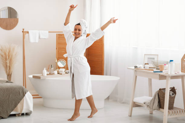 istock Happy Lady Dancing Having Fun Enjoying Beauty Routine In Bathroom 1470753886