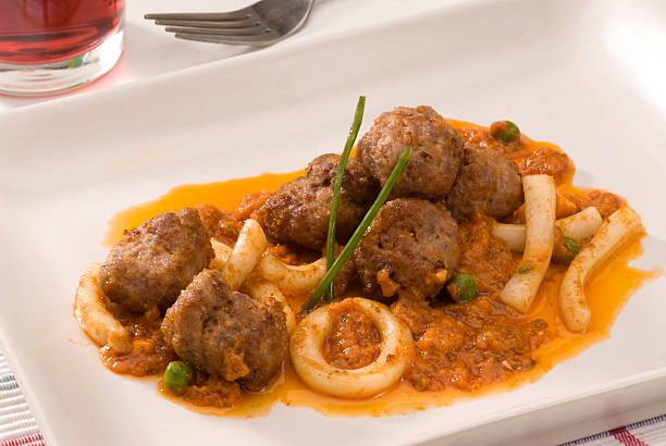 Spanish cuisine. Cuttlefish and meatballs. stock photo