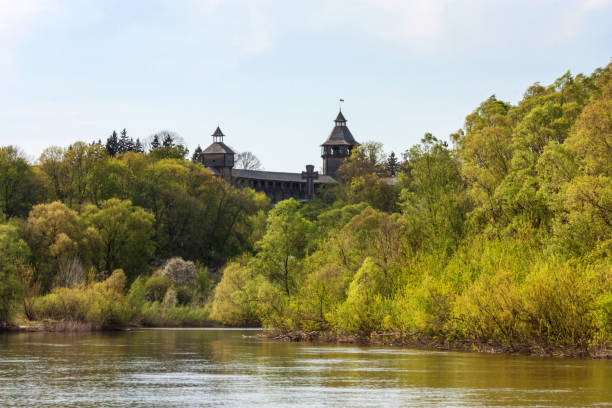 Spring landscape - view of the wooden reconstruction of the Baturyn Citadel, Ukraine Spring landscape - view of the wooden reconstruction of the Baturyn Citadel on the banks of the Seym river, Chernihiv Oblast of northern Ukraine baturyn stock pictures, royalty-free photos & images