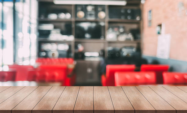 istock Empty wooden table top with lights bokeh on blur restaurant background. 1470755460