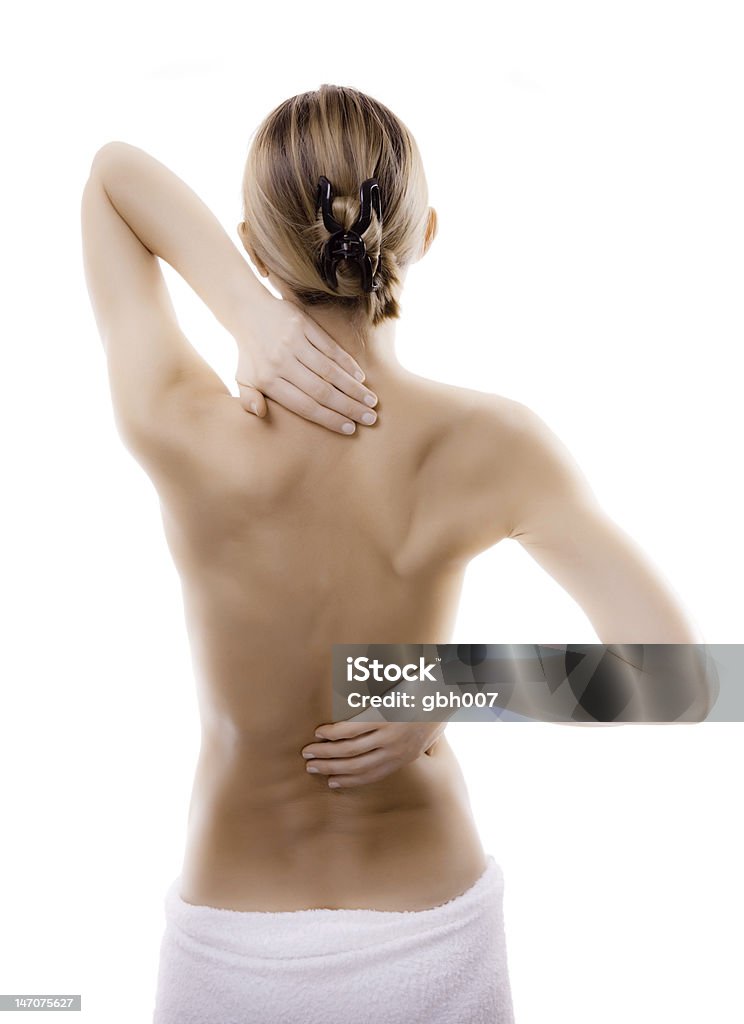 Woman massaging pain back Woman massaging pain back  Women Stock Photo