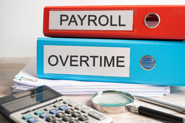 istock Payroll Overtime. Binder data finance report business with graph analysis in office. 1470756626