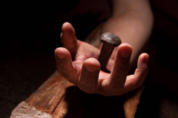 Hand of Jesus pierced with a nail stock photo