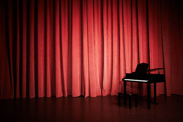 istock Mini piano of a stage with red curtains 147075888