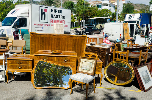 BENALMADENA, COSTA DEL SOL, PROVINCE OF MALAGA, SPAIN - September 14, 2016: Old furniture, vintage mirrors and paintings on a local swap meet.
