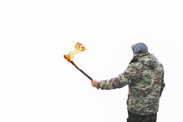 Silhouette of a man using a megaphone and holding flare doing protest with smoke background