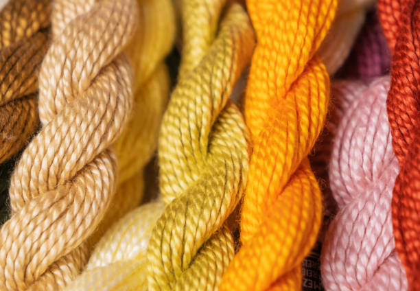 istock Multi-colored threads for embroidery close-up, twisted into bundles. Hobby, handmade, embroidery 1470762568