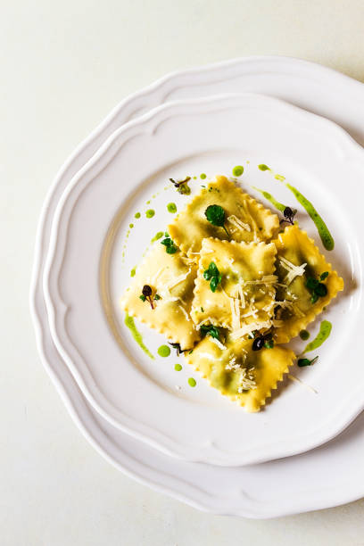 istock Ravioli with spinach and cheese, green sauce, on a light background, selective focus, no people, 1470762829