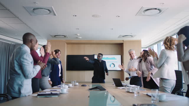 crazy business people celebrating in boardroom successful sales team corporate victory colleagues applause in office meeting enjoying winning success 4k