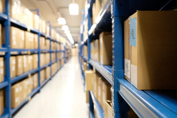istock Row of packages and boxes inside a distribution warehouse 1470768017