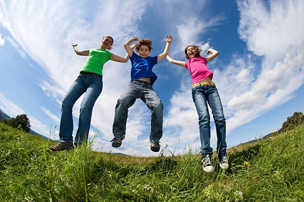 istock Active family jumping outdoor 147076860
