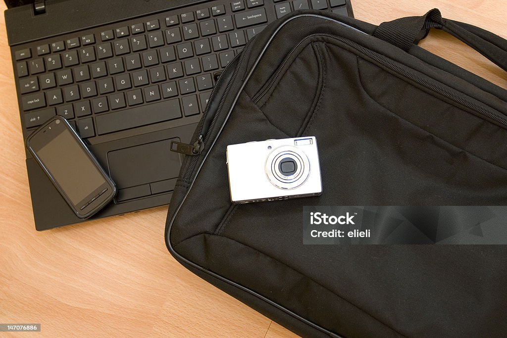 multimedia set Laptop, mobile, DC on a wooden desktop Bag Stock Photo