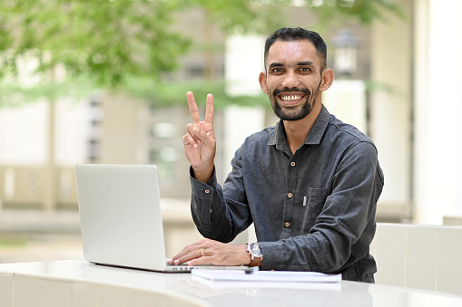 Portrait of student using laptop