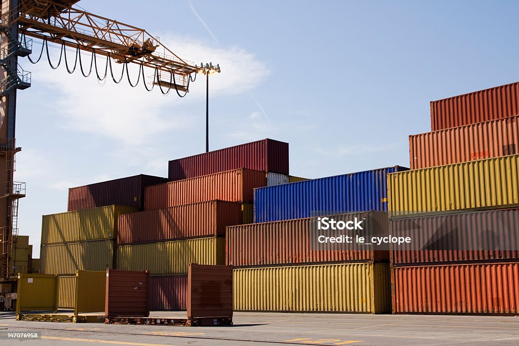 Containers in a port Containers waiting to be loaded in a major port, with partial view of the crane.  See other Port photos in my portfolio! Cargo Container Stock Photo