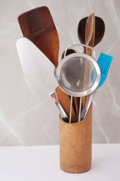istock Kitchen utensils in a wooden vase 1470773376