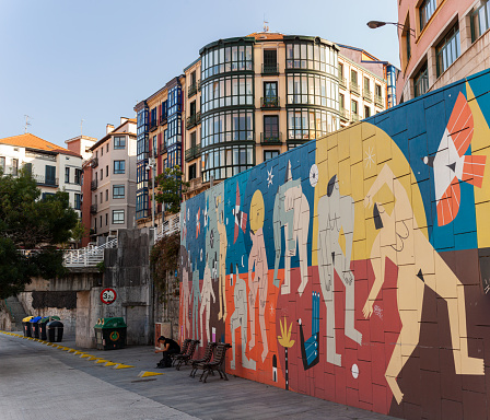 Bilbao, Spain - August 02, 2022: Wall with artistic graffiti or murales in the city