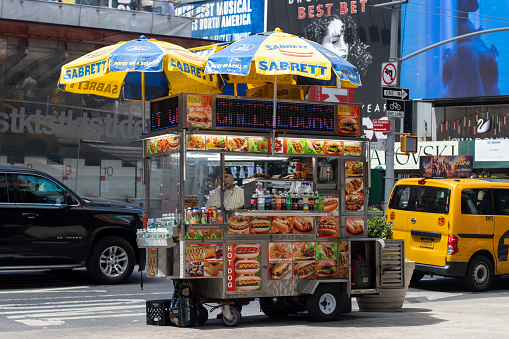 New York, NY, USA - July 5, 2022: A Sabrett food cart that sells hot dogs is seen in Times Square, Midtown Manhattan, New York City.
