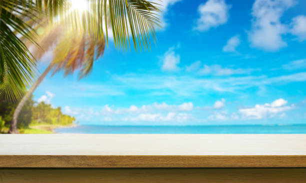 istock Art  Empty wooden table on sunny blurred tropical sandy beach background 1470777666